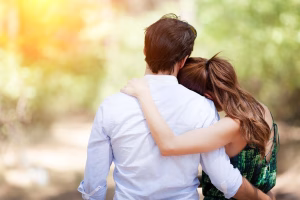 Husband and wife embracing to show support to each other.