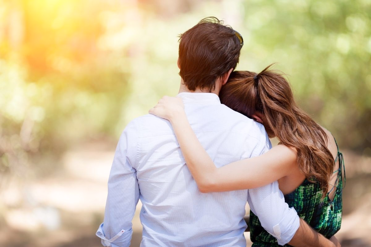 Husband and wife embracing to show support to each other.