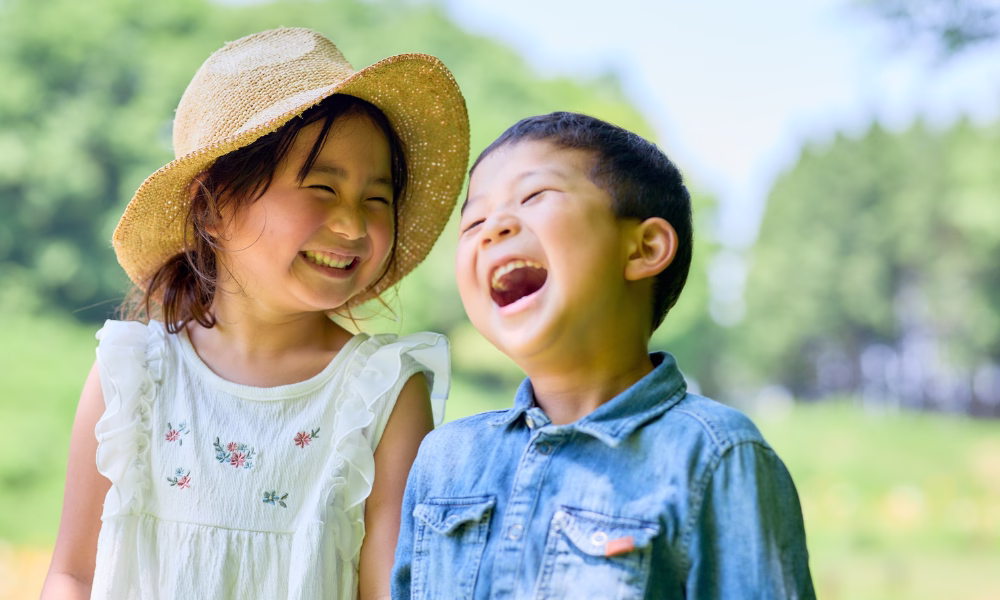 children laughing as they learn in nature